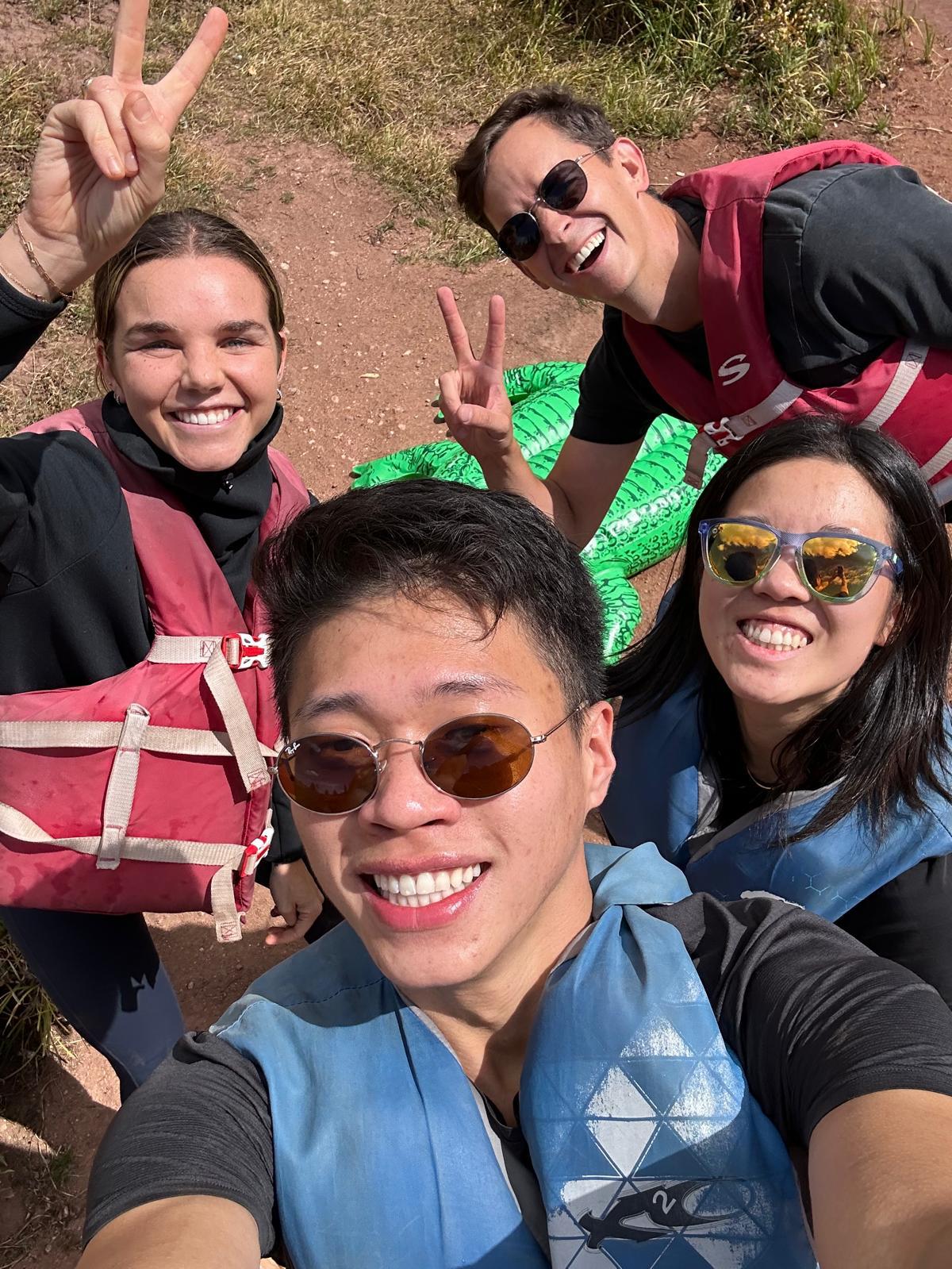 A group of people taking a selfie in the sun